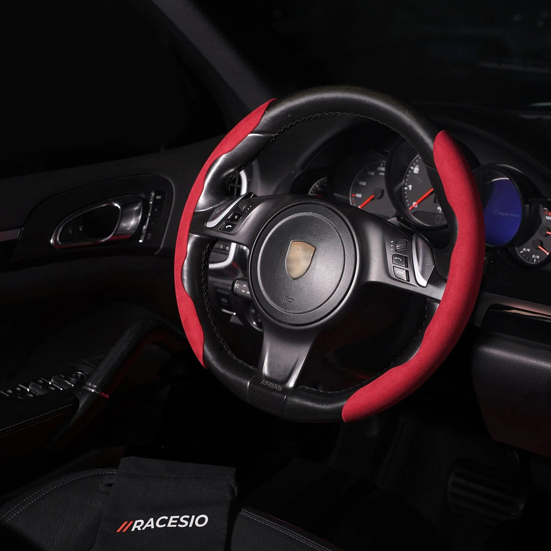 Segmented Alcantara steering wheel cover installed on a luxury car steering wheel